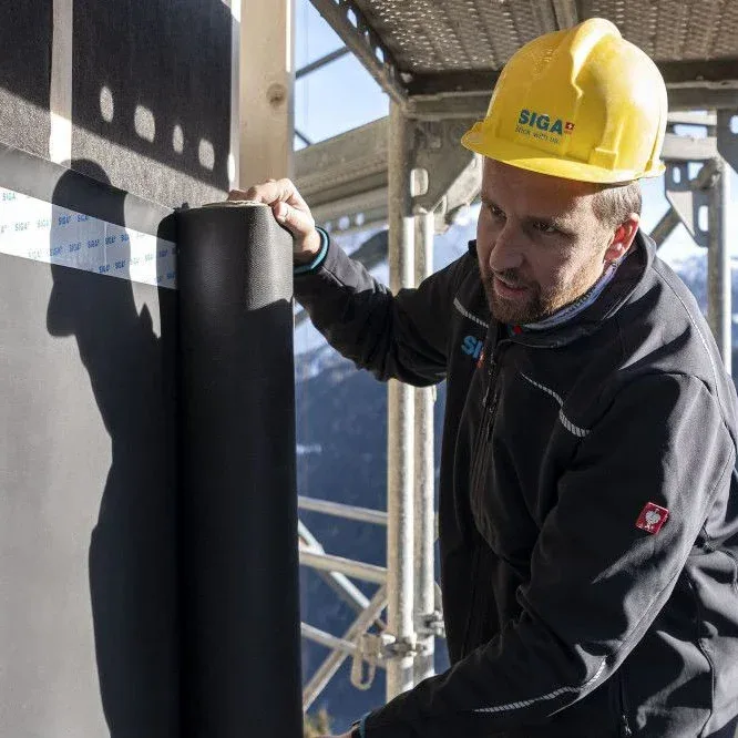 SIGA construction worker building an eHaus